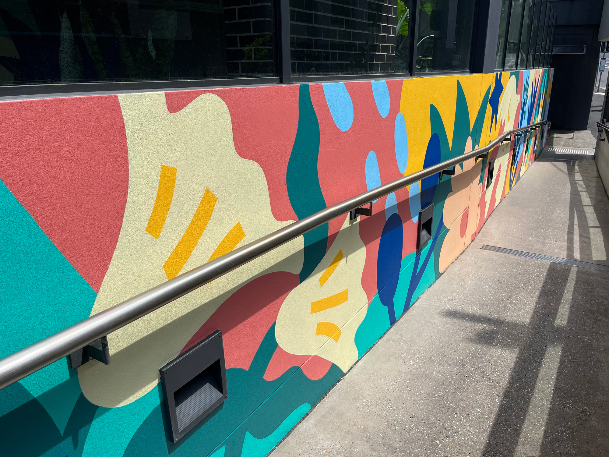 Walkway mural painted by Nico Nicoson in Sydney.
